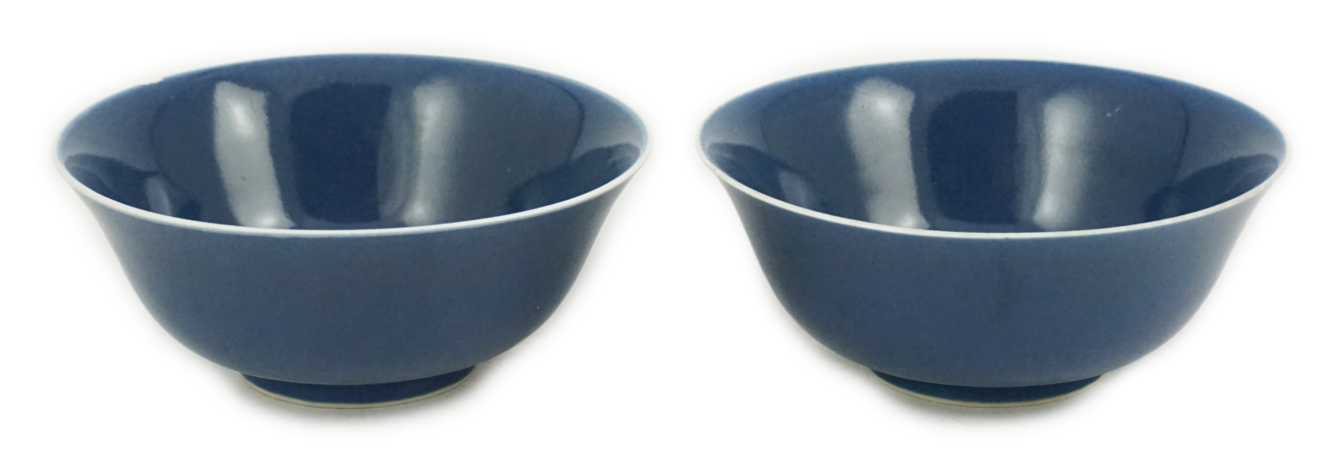 A pair of Chinese powder blue glazed bowls, Daoguang mark and of the period (1821-50)